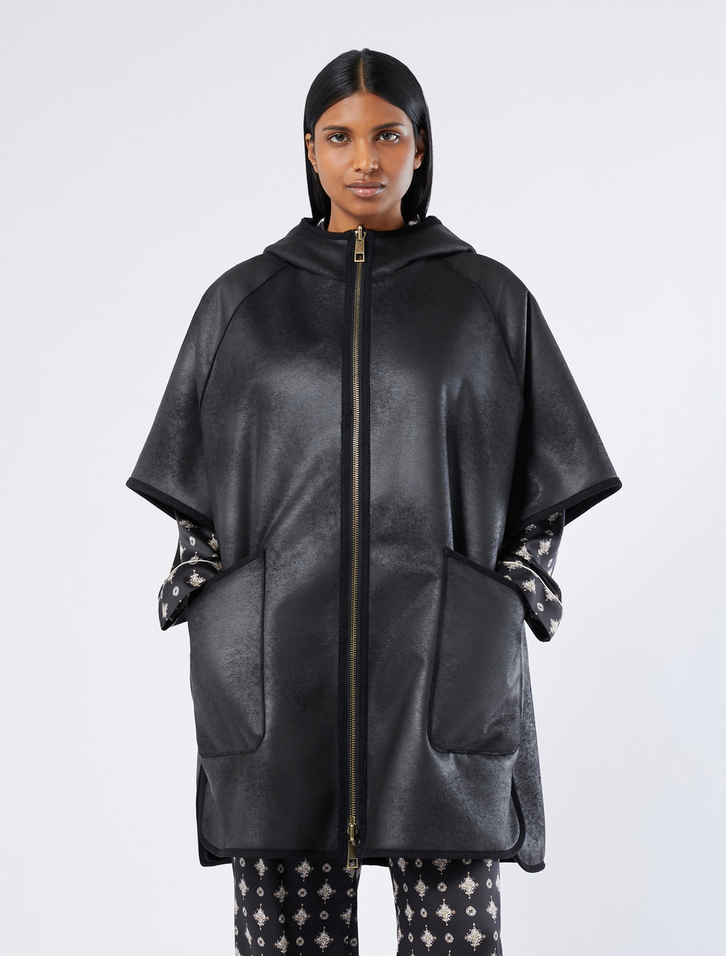 Reversible cape with a soft texture