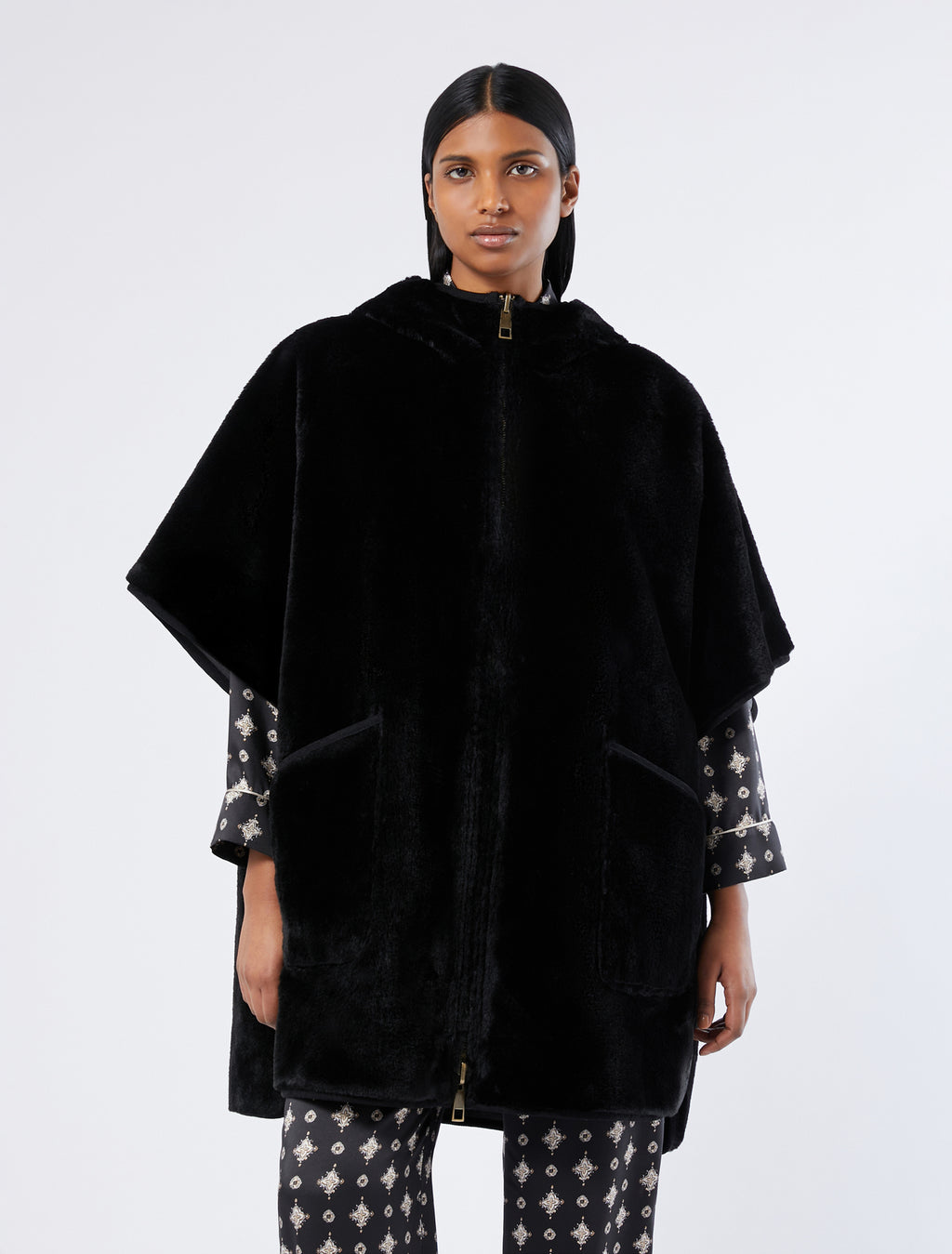 Reversible cape with a soft texture